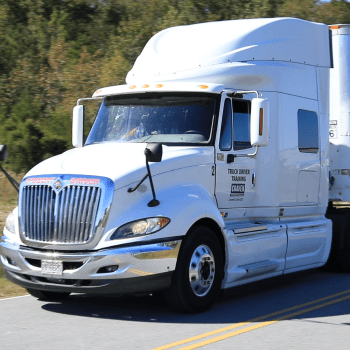 18-wheeler truck driving on two-lane road