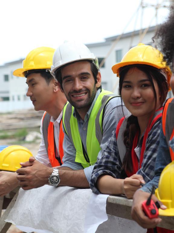 Four young construction workers